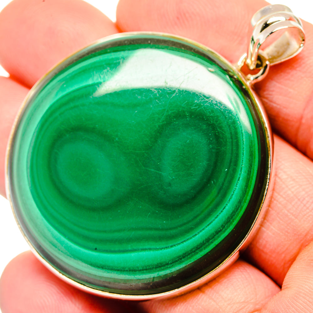 Round green malachite pendant with sterling silver bezel and loop bail