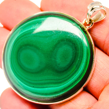 Round green malachite pendant with sterling silver bezel and loop bail