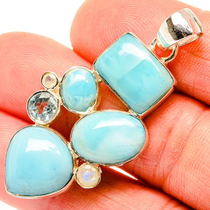 Light blue oval gemstone pendant in 925 sterling silver with silver bail, close-up
