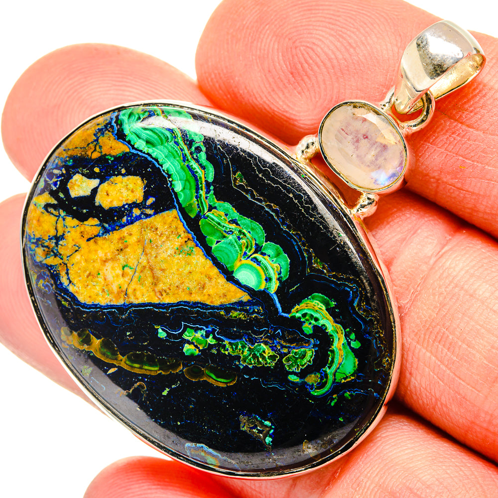 Oval multicolor cabochon pendant with rainbow-like bands and sterling silver bail