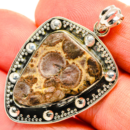 Sterling silver teardrop pendant with brown rhyolite stone and beaded border