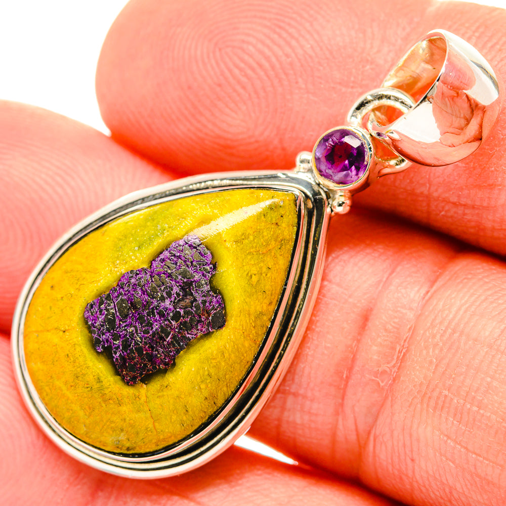 Close-up sterling silver pendant bail with purple amethyst and yellow teardrop stone
