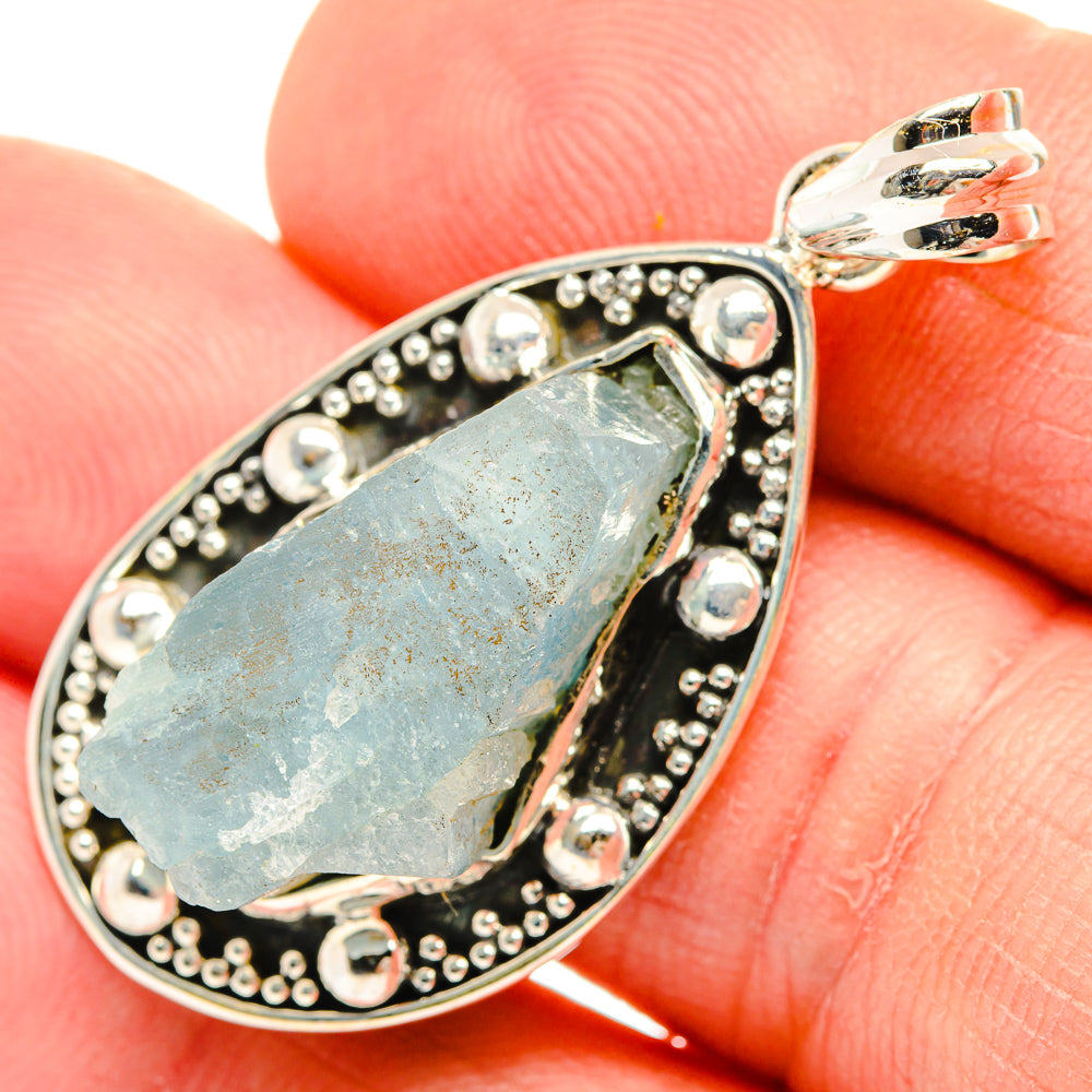 Rough aquamarine pendant in oval sterling silver bezel with beaded accents
