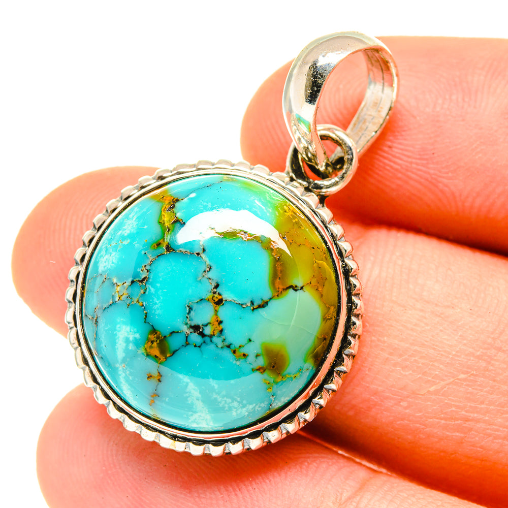 Round turquoise cabochon pendant in sterling silver bezel with top loop