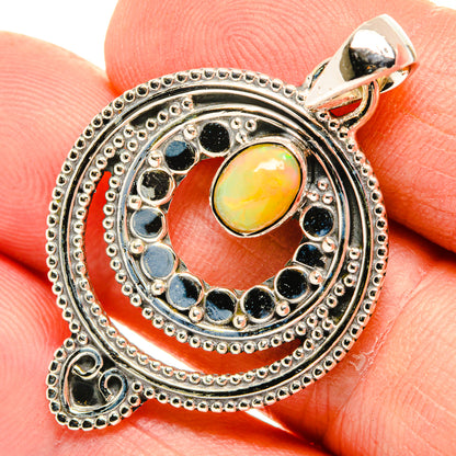 Sterling silver opal pendant close-up, yellow center opal with blue halo stones