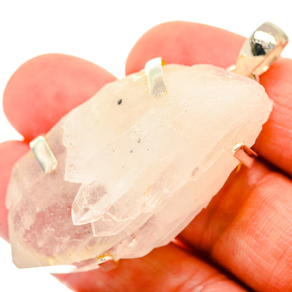 Pale pink quartz crystal pendant with silver bail, faceted chunk shape