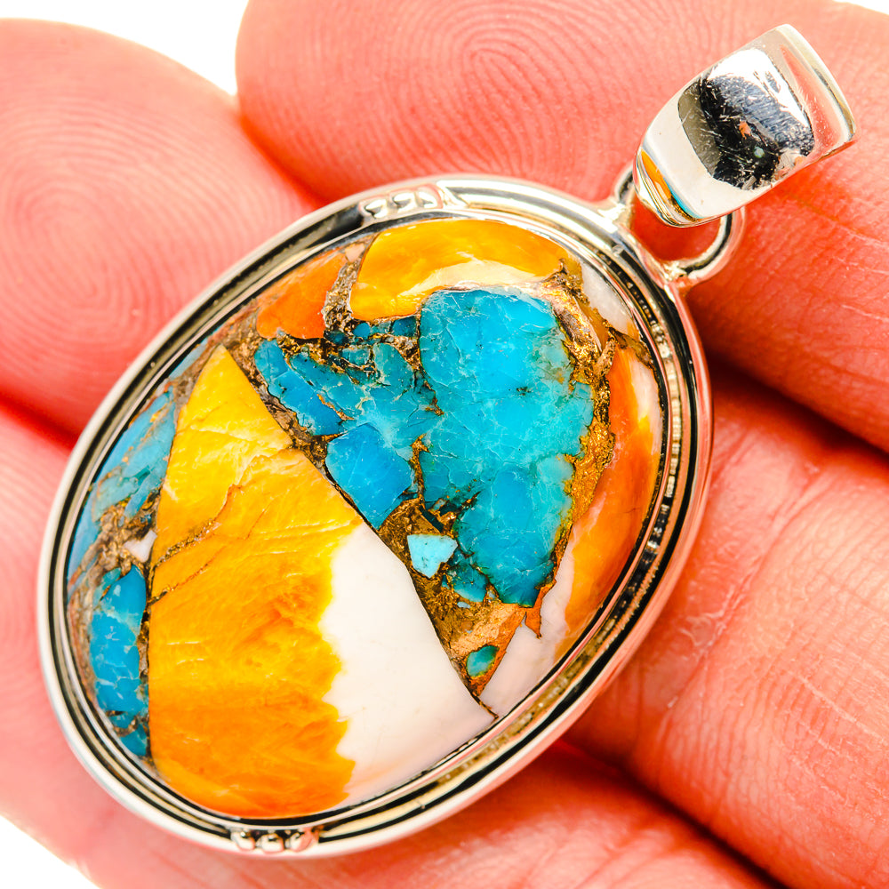 Sterling silver oval pendant close-up with turquoise and orange spiny oyster stone