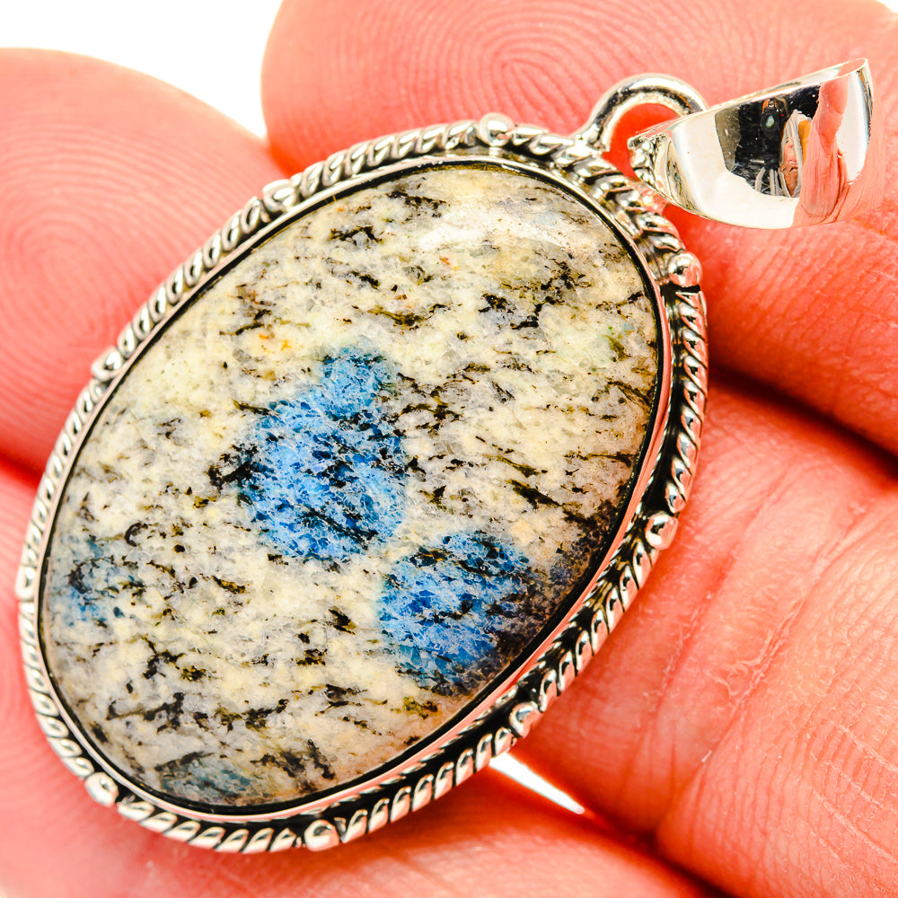 Sterling silver teardrop pendant with blue azurite stone, rope-edge bezel
