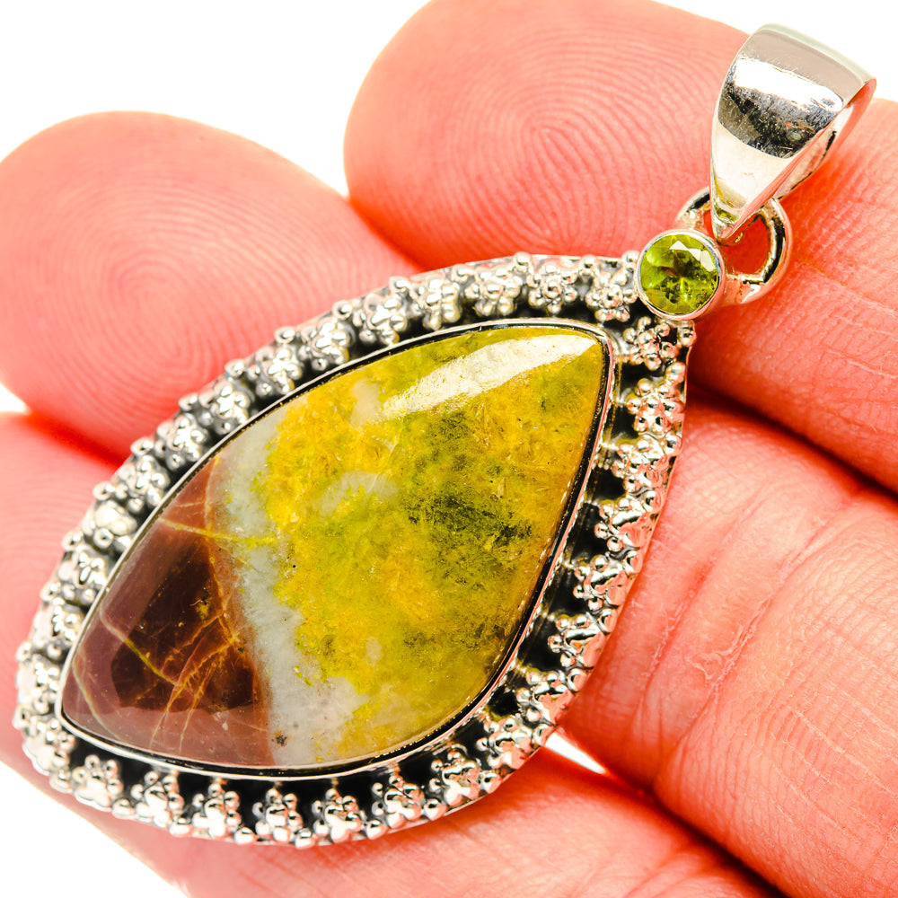 Sterling silver teardrop pendant with green peridot accent and yellow-green gemstone