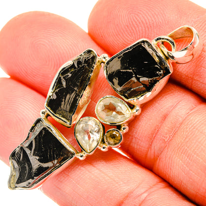 Sterling silver pendant with black shungite, clear faceted stones, small yellow citrine drop