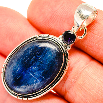 Sterling silver pendant with oval blue kyanite and small purple gemstone accents