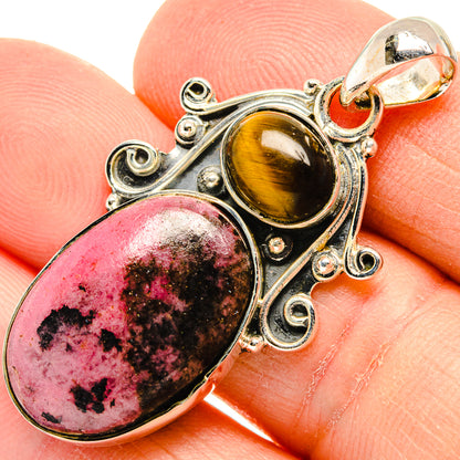 Sterling silver pendant close-up with pink rhodonite and golden tiger eye cabochons