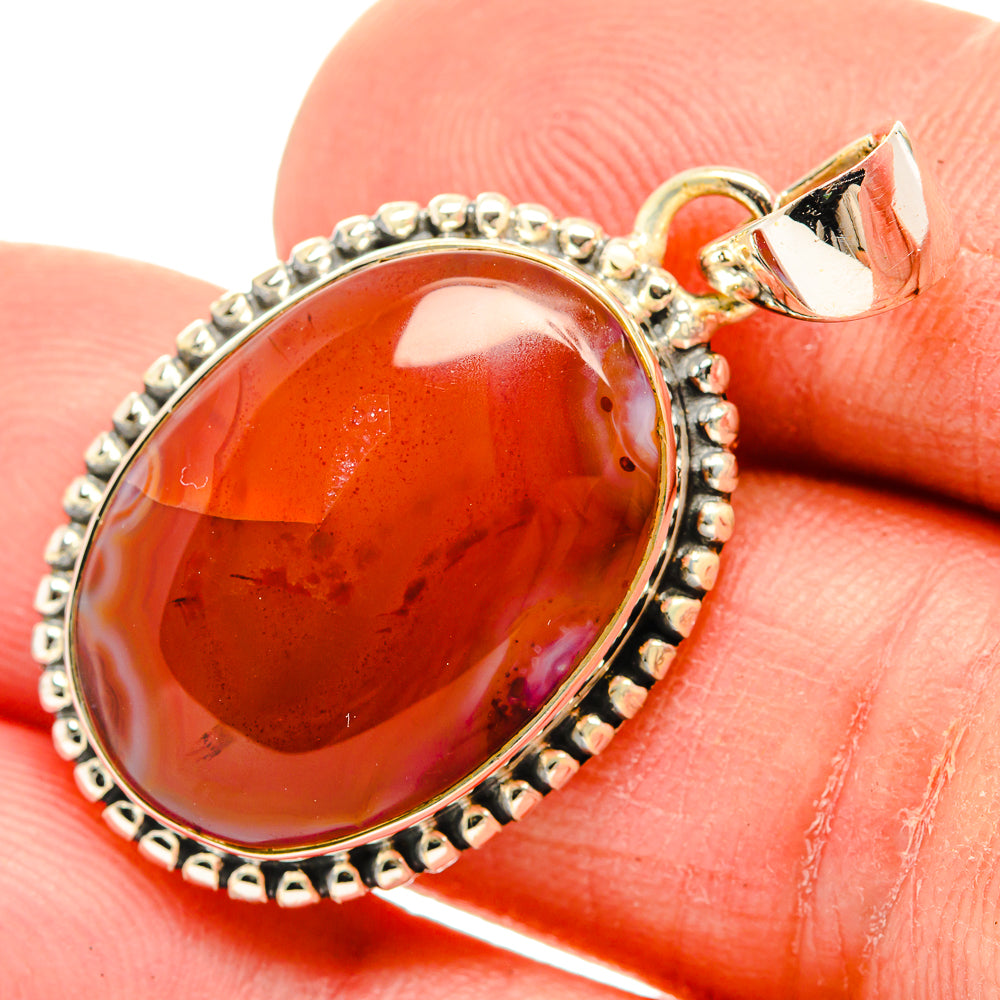Oval red agate pendant close-up, 925 sterling silver setting and bail detail