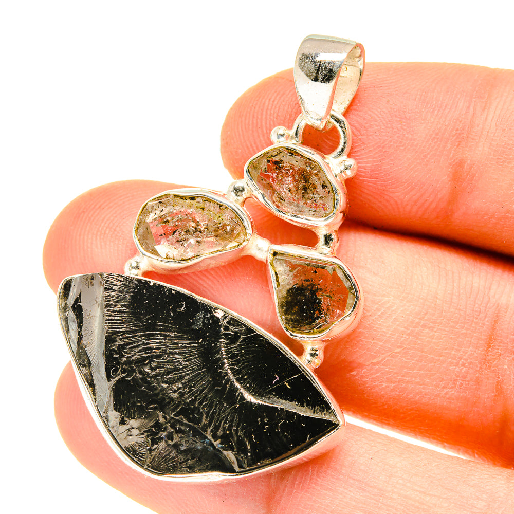 Sterling silver shungite pendant with dark rough stone and three oval crystals in bezel settings