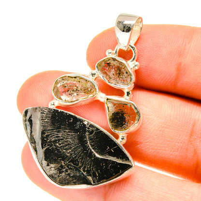 Sterling silver shungite pendant with dark rough stone and three oval crystals in bezel settings
