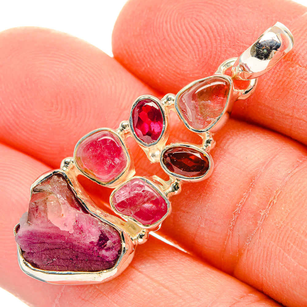 925 sterling silver gemstone pendant close-up with red and pink bezel-set stones