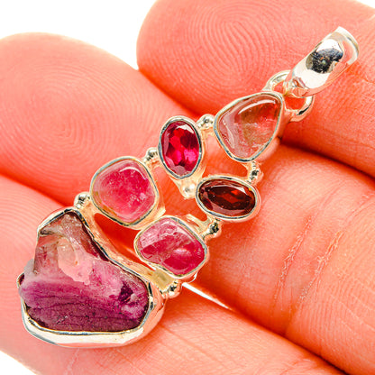 925 sterling silver gemstone pendant close-up with red and pink bezel-set stones