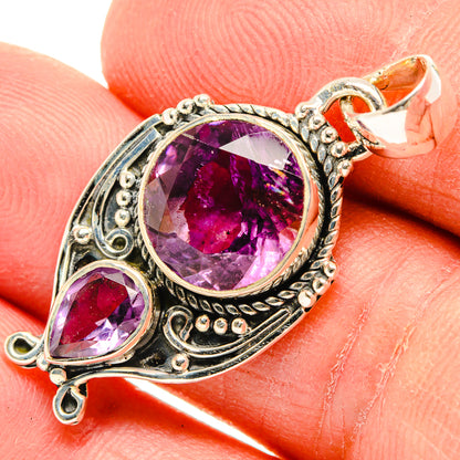 Amethyst pendant in silver with large round faceted purple stone and teardrop side stone
