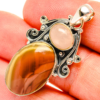 Sterling silver pendant close-up with rose quartz and orange jasper oval cabochons