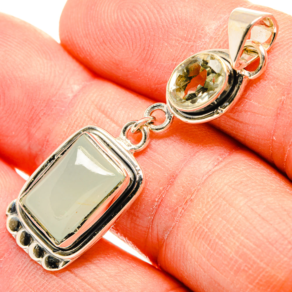 Sterling silver pendant with rectangular opalescent stone and round green gemstone