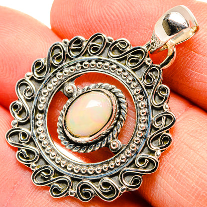 925 sterling silver opal pendant with oval cabochon and ornate round filigree bezel