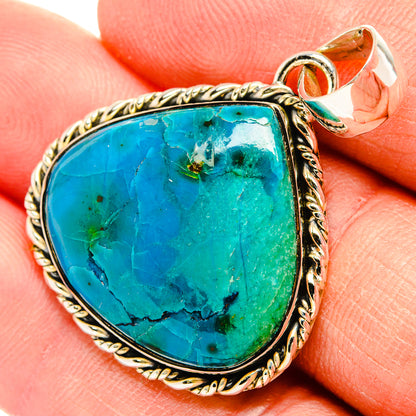 Chrysocolla teardrop pendant in silver-tone bezel with rope border, loop bail detail