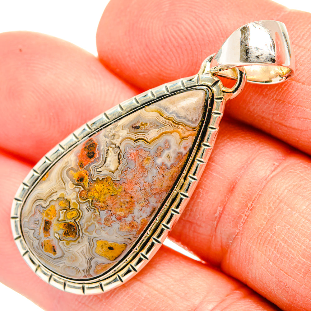 Sterling silver lace agate teardrop pendant with patterned tan, orange, and gray stone