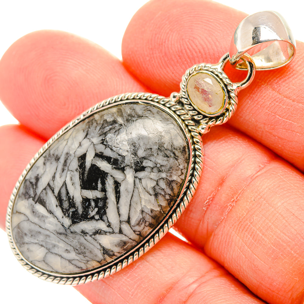Oval pinolith jasper pendant with silver rope bezel and pale yellow accent stone