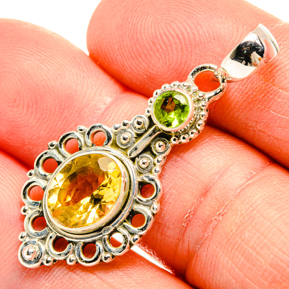 Sterling silver pendant with round faceted citrine and green peridot accents