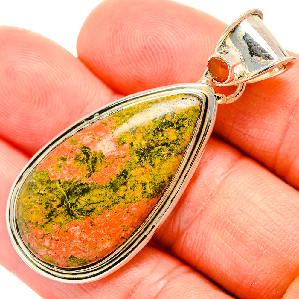 Close-up teardrop unakite stone pendant with sterling silver bezel and bail