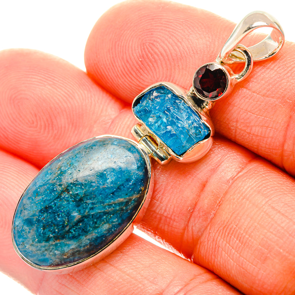 Sterling silver pendant with oval blue apatite stone and garnet accent bead