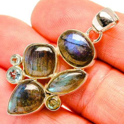 Iridescent gemstone pendant bail with oval blue-green stones and round accents in gold tone