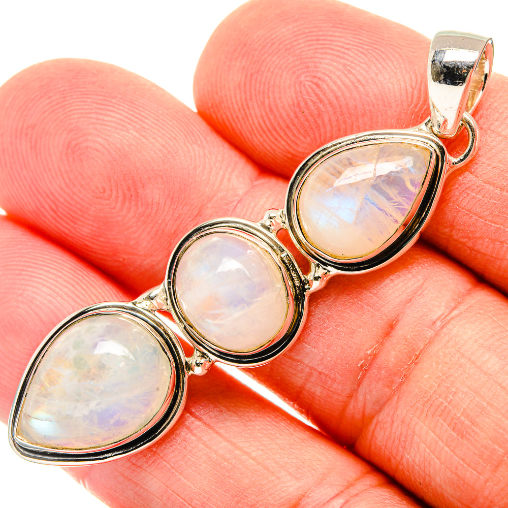 Sterling silver opalescent moonstone teardrop pendant, close-up of three pieces
