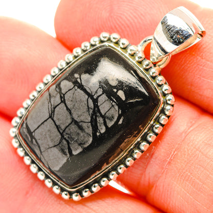 Sterling silver jasper pendant with black-and-gray crackled stone in oval bezel