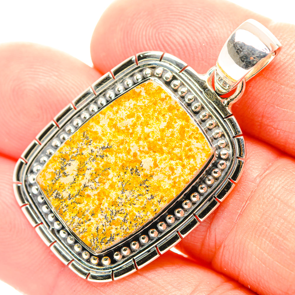 Sterling silver pendant with rectangular yellow dendrite gemstone and decorative bezel