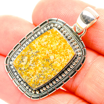 Sterling silver pendant with rectangular yellow dendrite gemstone and decorative bezel