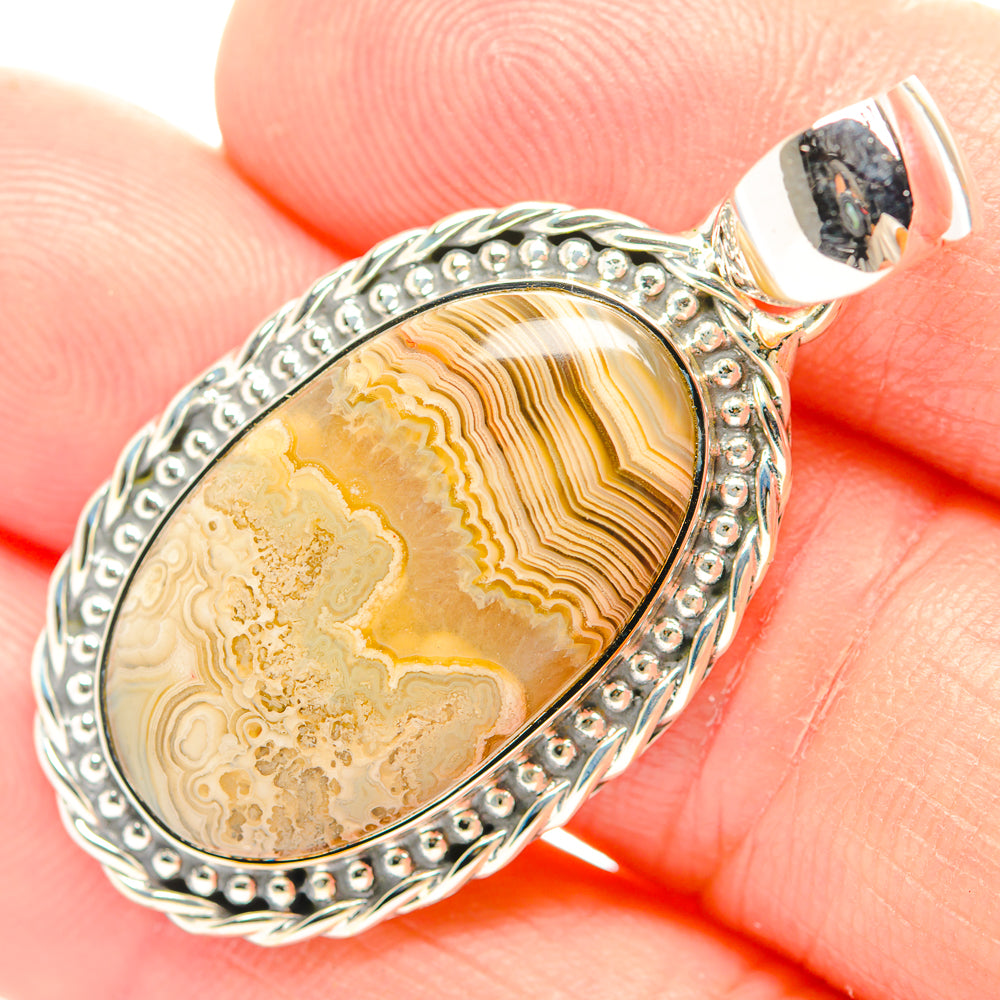 Oval lace agate pendant in 925 sterling silver with beaded frame and bail, yellow stone
