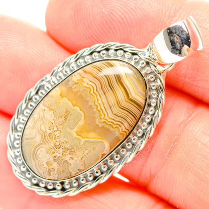 Oval lace agate pendant in 925 sterling silver with beaded frame and bail, yellow stone