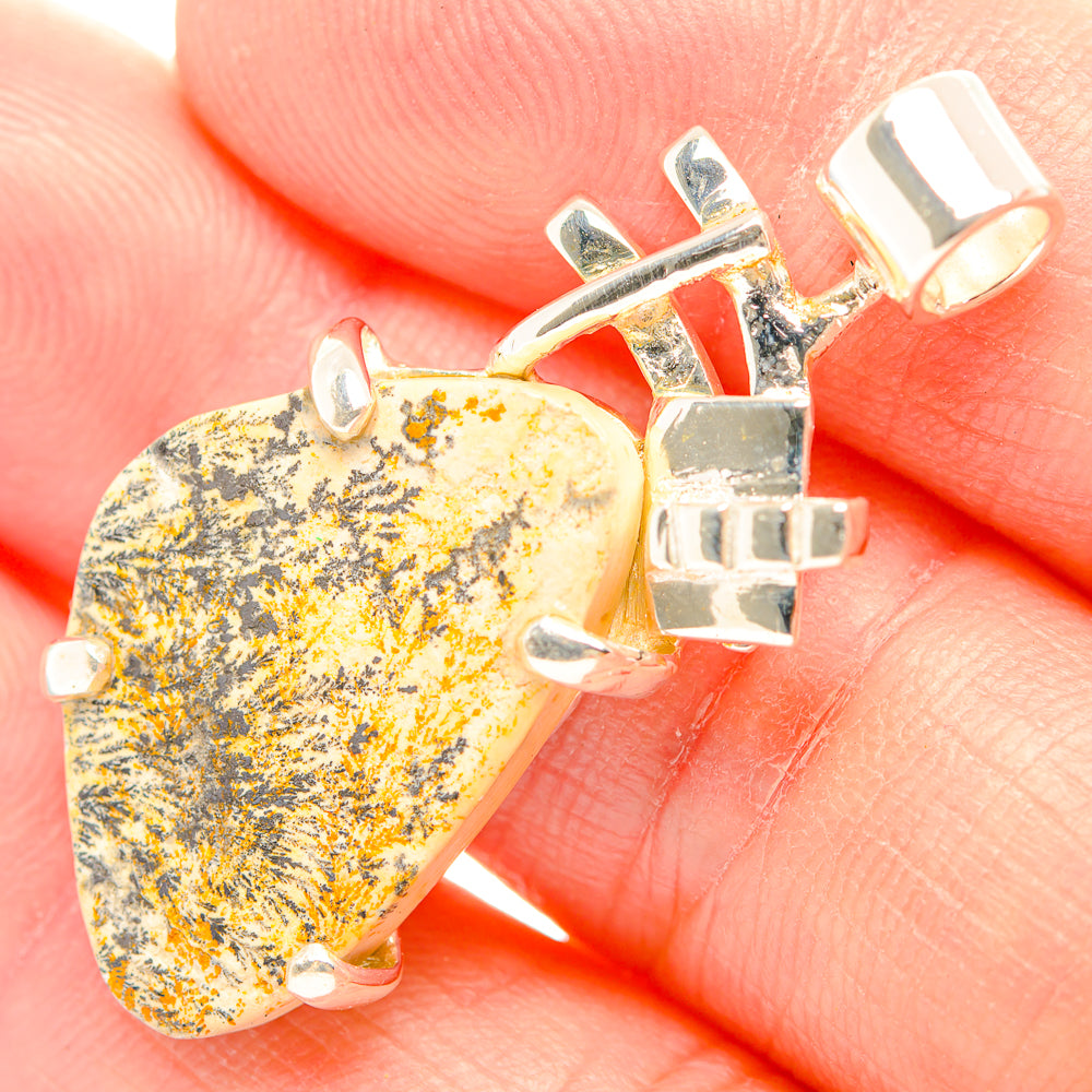 Heart-shaped yellow-and-black dendrite stone pendant in 925 silver setting