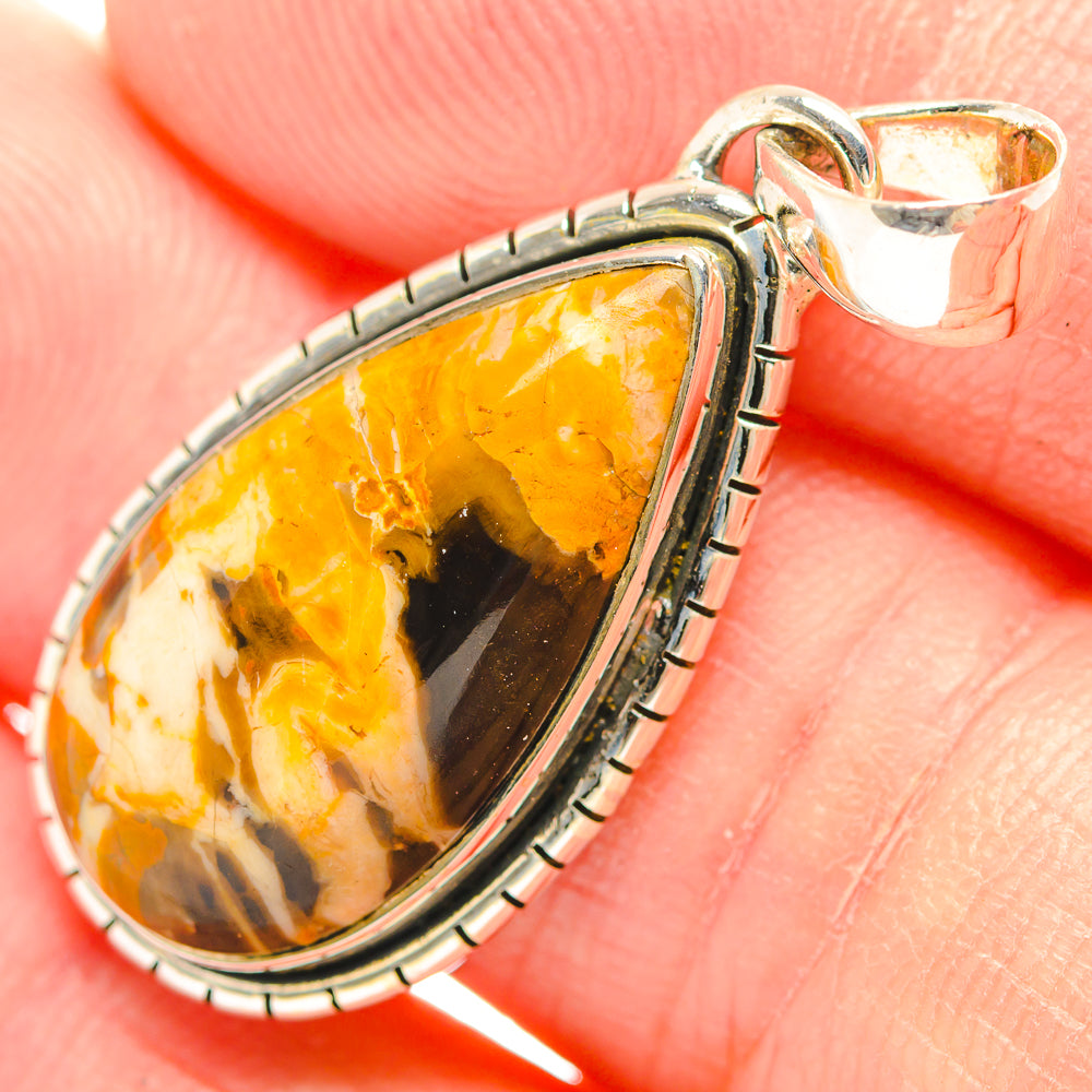 Sterling silver oval jasper pendant close-up with loop bail and beaded edge