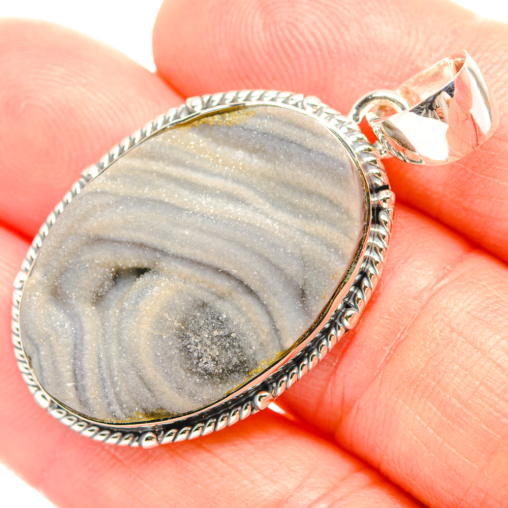 Oval sterling silver pendant with blue-gray drusy striped stone and rope bezel