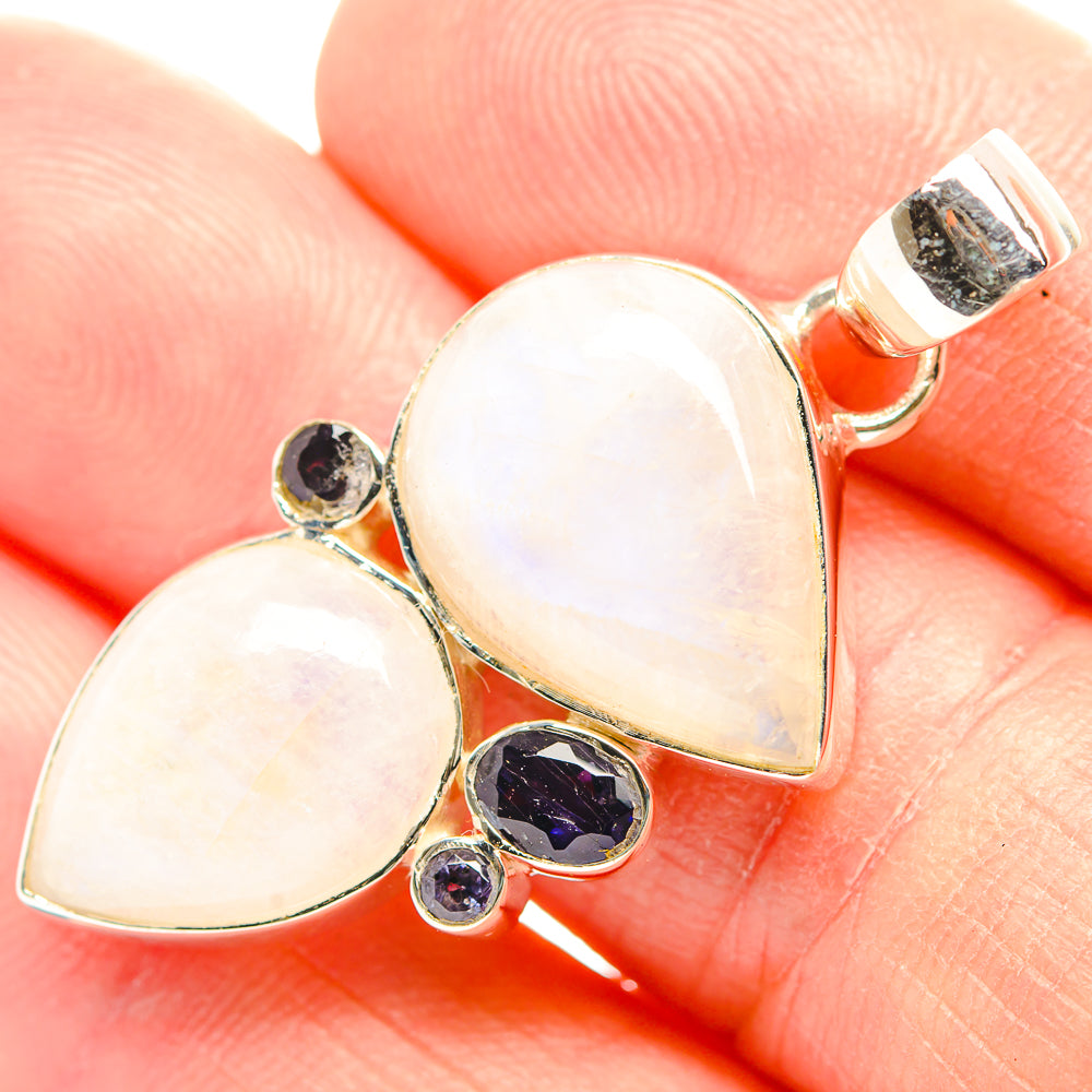 Moonstone heart pendant close-up with dark onyx round stones and sterling silver bail
