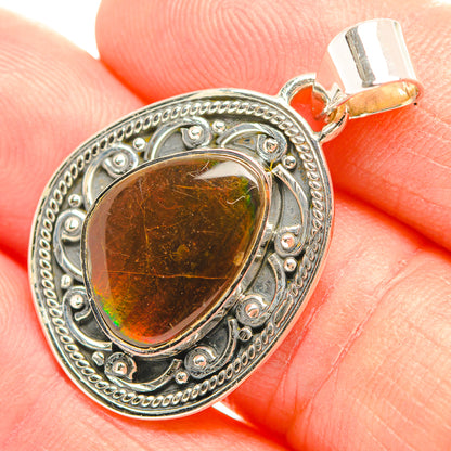 Sterling silver ammolite pendant with teardrop gemstone, amber brown and green flashes