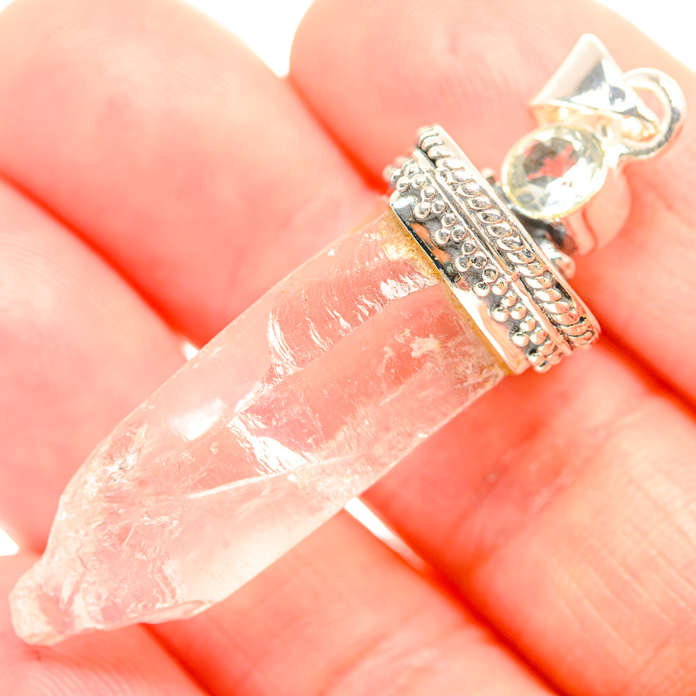 Rough white quartz pendant close-up with beaded silver wrap and clear crystal bail