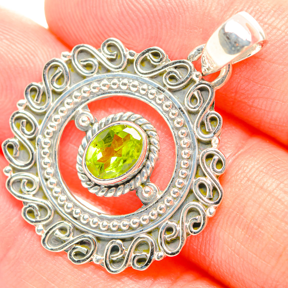 925 sterling silver peridot pendant with green oval gemstone in ornate filigree frame