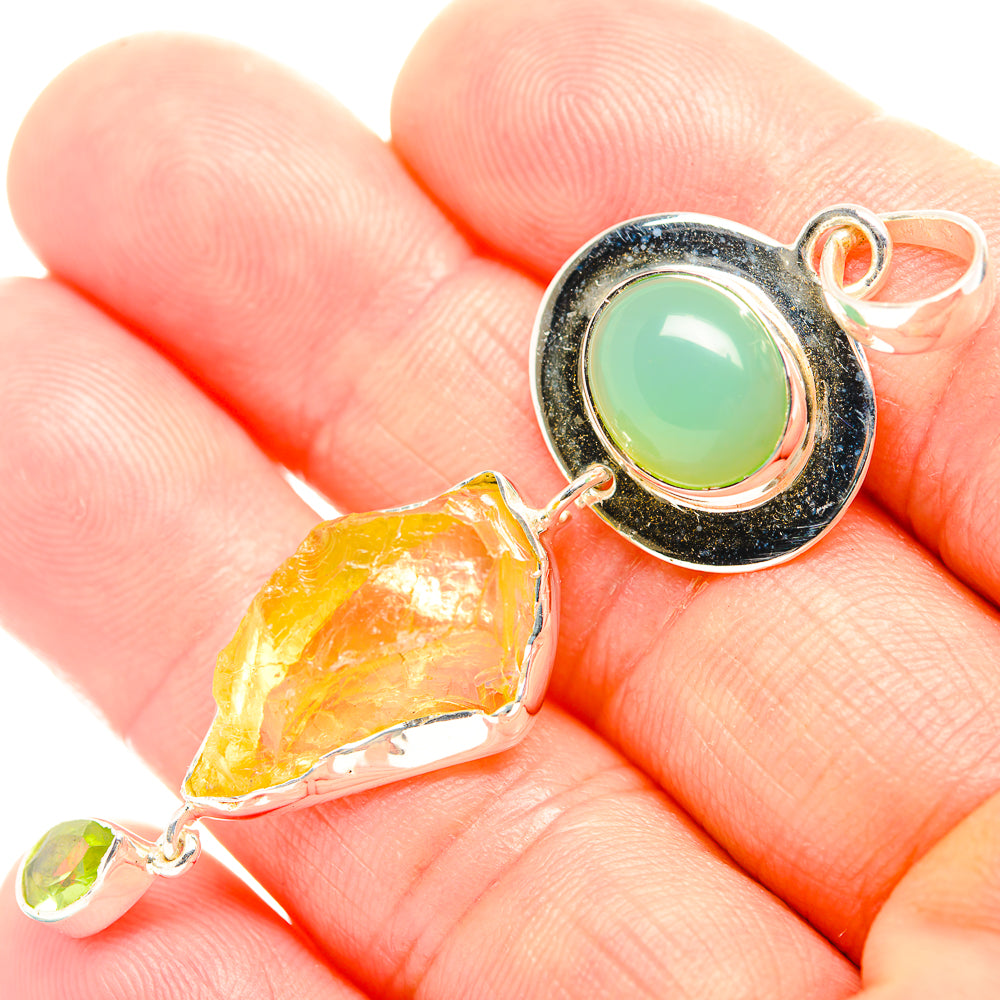 Sterling silver pendant with green oval chrysoprase bezel and rough yellow citrine drop