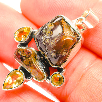 Sterling silver fire agate and citrine pendant close-up with amber teardrop accents