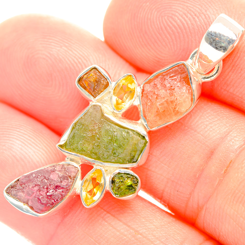 Silver pendant with rough multicolor stones in irregular shapes, top loop bail
