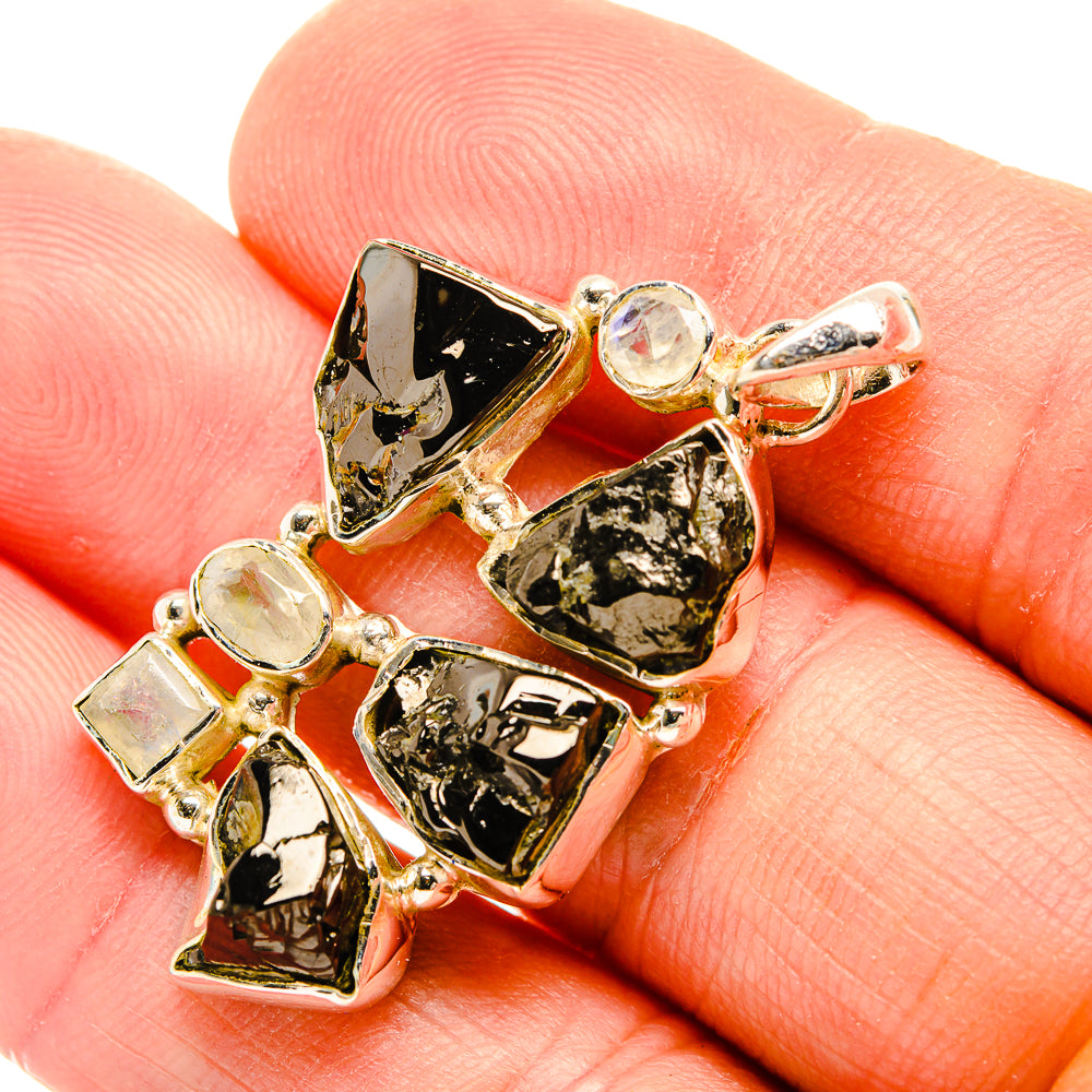 Rough shungite and white quartz pendant with metallic prongs and round quartz accents