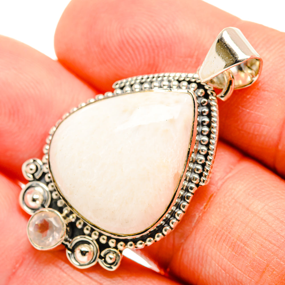 White scolecite teardrop pendant in 925 sterling silver with ornate bezel and bail